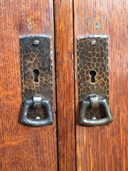 Small screw holes just above the two door handles have been filled with wood.